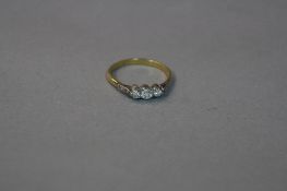 AN 18CT THREE STONE DIAMOND RING, ring size O, approximate weight 2.6 grams