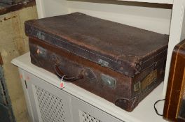 A LEATHER SUITCASE
