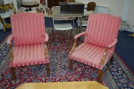 A PAIR OF GEORGE III STYLE LIBRARY CHAIRS, serpentine top rail over rectangular back, open scrolled
