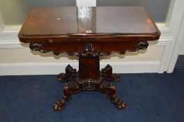 AN EARLY VICTORIAN ROSEWOOD STAINED RECTANGULAR FOLD OVER CARD TABLE, circular green baize inset, on