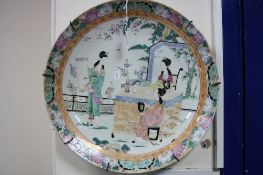 AN ORIEINTAL CHARGER, depicting Japanese ladies discussing a picture, approximate diameter 36.5cm