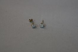 A PAIR OF 9CT DIAMOND STUDS, (one missing back)