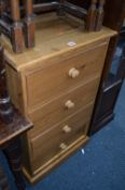 A TALL SLIM PINE CHEST, of four drawers