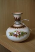 A SMALL HADLEYS WORCESTER FAIENCE VASE, florally decorated on cream ground, puce backstamp and F110,