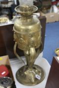 A BRASS ARTS AND CRAFTS OIL LAMP, with glass funnel (weighted base), height approximately 48cm (