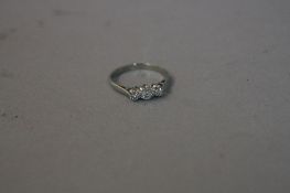 A MID 20TH CENTURY THREE STONE DIAMOND RING, estimated total round brilliant cut weight 0.40ct,