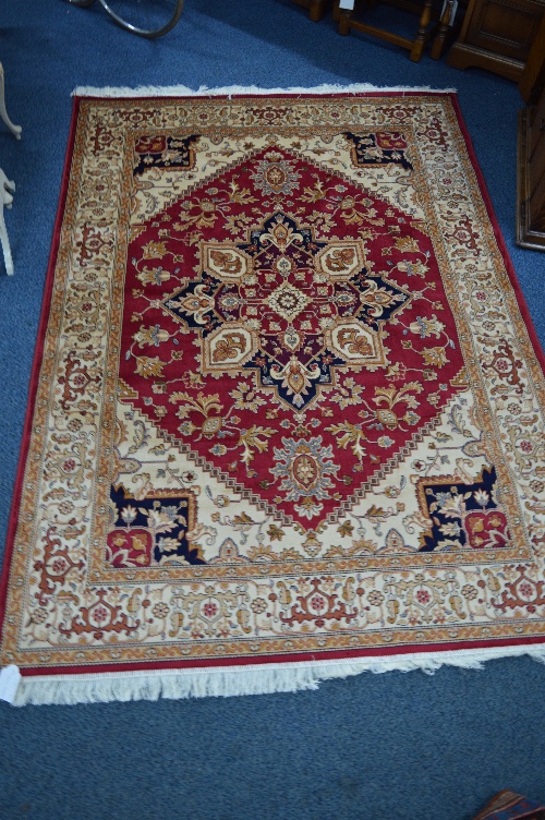 HERIZ STYLE CARPET, red, blue and beige ground, multi strap border, approximate size 228cm x 160cm