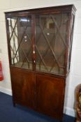 AN EDWARDIAN MAHOGANY AND INLAID ASTRAGAL GLAZED TWO DOOR DISPLAY CABINET, with two glass shelves