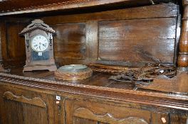 AN OAK ROPE EDGED ANEROID BAROMETER, a mantle clock, carpet beaters etc (6)