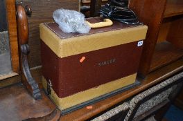 A SINGER SEWING MACHINE, a small mahogany bookcase and a child's chair (3)