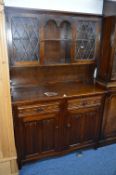 AN OAK LINENFOLD DRESSER, with two drawers, double doors to base, width 116cm