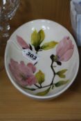 A MOORCROFT POTTERY OVAL BOWL, Magnolia pattern on cream ground, impressed and painted marks to