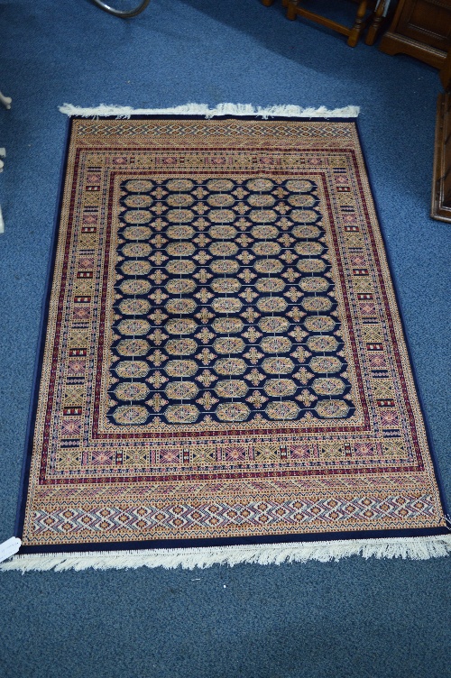 BOKHARA STYLE GROUND RUG, multi coloured, multi strap border, approximate size 190cm x 135cm