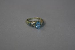 A 9CT BLUE STONE RING SET WITH DIAMONDS, ring size M, approximate weight 2.9 grams