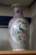 A LARGE ORIENTAL REPUBLIC OF CHINA VASE, famille rose decoration with peacocks, birds and foliage,