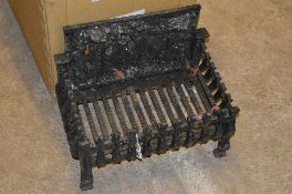 A CAST IRON FIRE GRATE, with a farrier scene to shallow back, approximate height 34cm x width 49cm x
