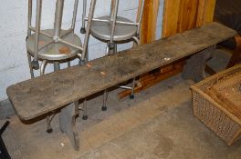 A VINTAGE WOODEN TRESTLE STYLE BENCH