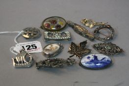 A COLLECTION OF SILVER, and costume brooches