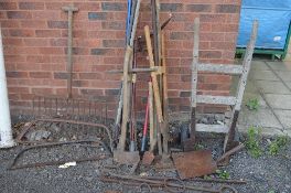A QUANTITY OF VINTAGE GARDEN TOOLS, including a hay rack and a sack truck etc