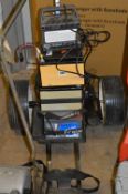 AN ELECTRIC GOLF TROLLEY, with three batteries and charger (4)