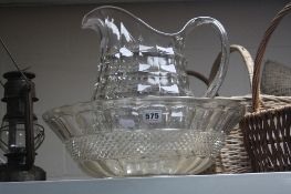 A GLASS JUG AND BOWL