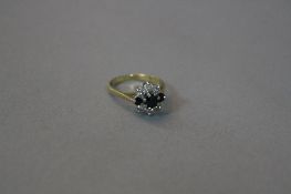 AN 18CT SAPPHIRE AND DIAMOND CLUSTER RING, ring size I, approximate weight 3.2 grams