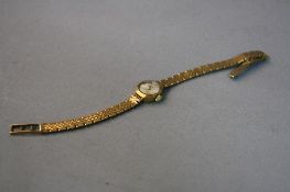 A 9CT REGENCY LADIES WRISTWATCH, on a 9ct strap, approximate weight 12.5 grams