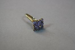 A 10K TANZANITE CLUSTER RING, ring size T, approximate weight 4.5 grams