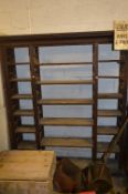 AN OAK OPEN BOOKSHELF, with laddered dividers and adjustable pine shelves, approximate size height