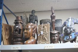 A GROUP OF WOODEN TRIBAL ITEMS, including busts, plaques, etc (11)