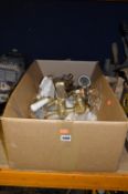 A BOX CONTAINING A BRASS BATH/SHOWER TAP, four bottles and two various lengths of metal curtain
