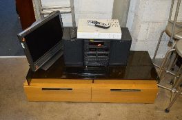 A SONY 20' LCD TV, Skybox and Sony hi-fi with two speakers (three remotes), a modern oak effect TV