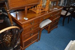A BRADLEY YEW WOOD DRESSING TABLE, with nine drawers, approximate size width 156cm x depth 47cm x