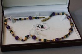 A 9CT AMETHYST NECKLACE, approximate length 43cm
