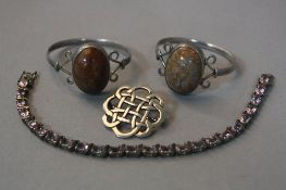 A SILVER AND AMETHYST BRACELET, two silver and hardstone bangles and a silver brooch (4)
