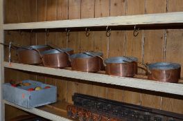 A SET OF FIVE COPPER GRADUATING PANS