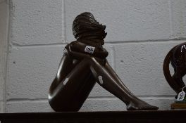 A NUDE BRONZED FIGURE OF A GIRL