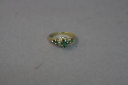 AN 18CT EMERALD AND DIAMOND RING, ring size J, approximate weight 3.1 grams