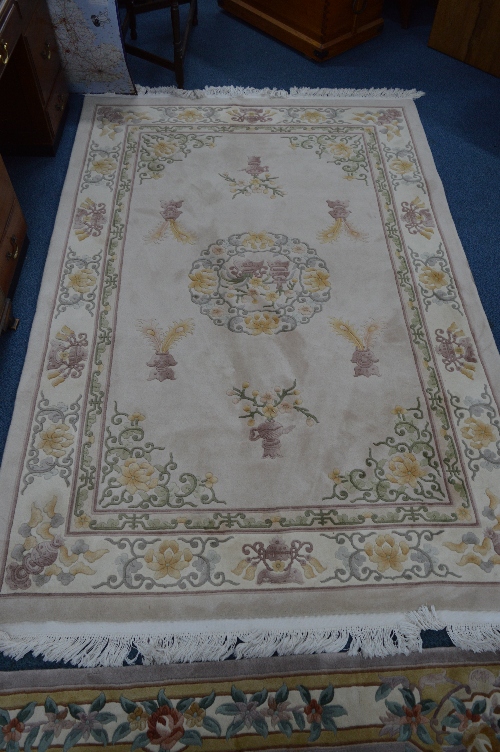 A CHINESE STYLE WOOL CARPET SQUARE, cream ground, approximate size 280cm x 184cm and another similar