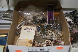 A BOX OF MIXED COSTUME JEWELLERY, including silver fob, etc