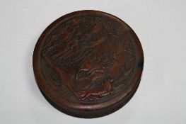 A CIRCULAR 19TH CENTURY BOX WITH RELIEF WORK, entitled 'Retour de Chasse D'Henri IV'