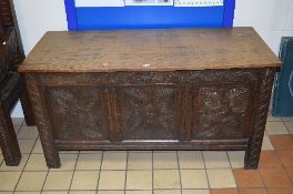 A GEORGIAN CARVED OAK TRIPLE PANELLED COFFER, approximate size width 131cm x depth 53cm x height