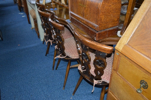 A SET OF FOUR ERCOL CHAIRS, with removable cushions and an oak occassional table (5)