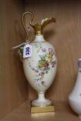 A ROYAL WORCESTER BLUSH IVORY EWER, florally decorated, with moulded mask (nose rubbed) to the
