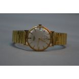 A 9CT GOLD LONGINES GENTS WRISTWATCH, secondary dial (engraved on back and CGWA 1932-1962)