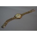 A J.W. BENSON 9CT GOLD GENTS WRISTWATCH, on a 9ct strap, approximately weight 54.0 grams