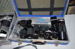 A CASE CONTAINING NINE LENSES, a slide duplicator and various converters