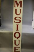 A DOUBLE SIDED INTERNALLY ILLUMINATED PLASTIC ADVERTISING SIGN, 'Musique', cut out red letters on