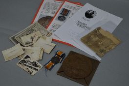 A WWI MEMORIAL DEATH PLAQUE, named to William Paddock, together with its card envelope and the
