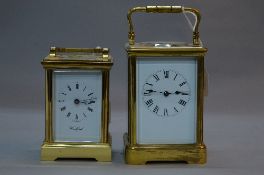 AN EARLY 20TH CENTURY BRASS CASED CARRIAGE CLOCK, white enamel dial, Roman numerals, gong strike,